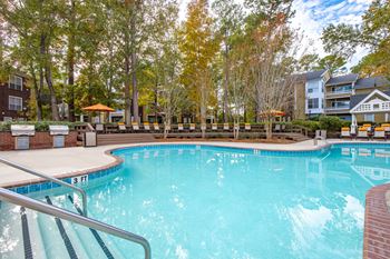 A swimming pool surrounded by trees and buildings  at Waverly Place, South Carolina